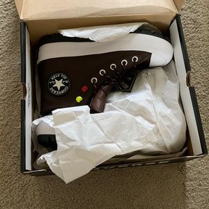 Brown leather converse